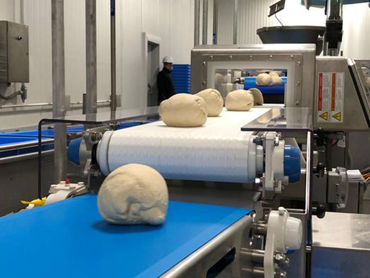 a machine with dough on it