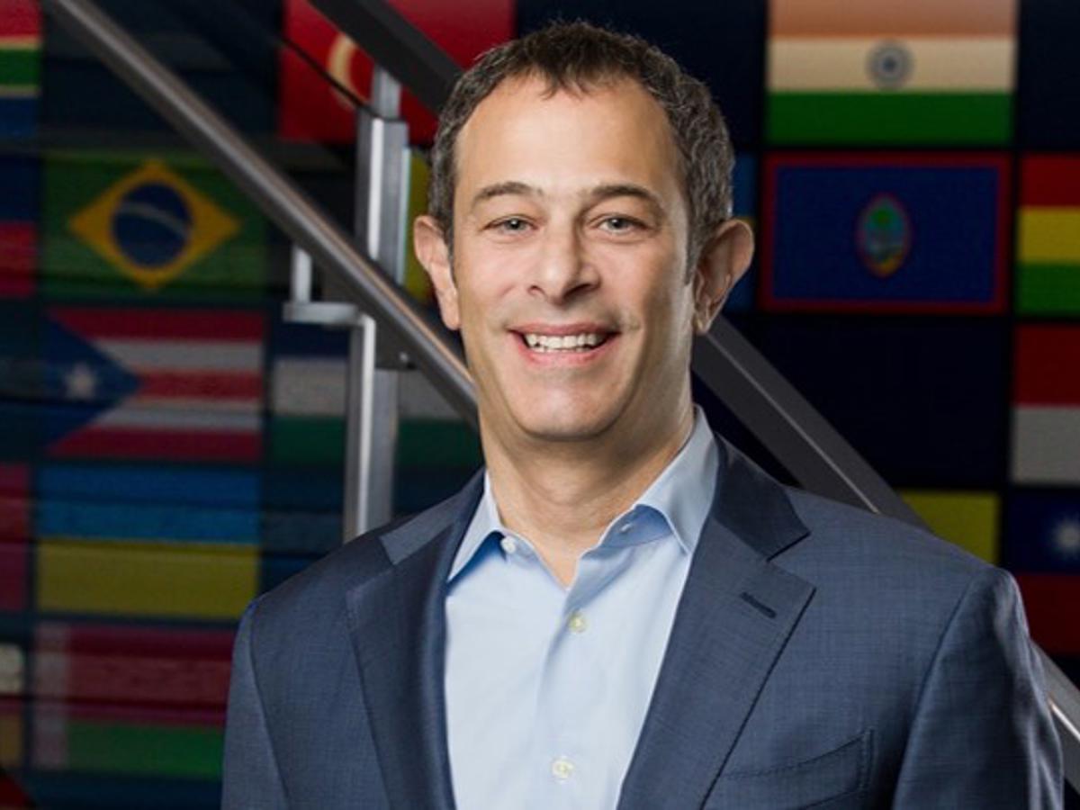 a man in a suit smiling