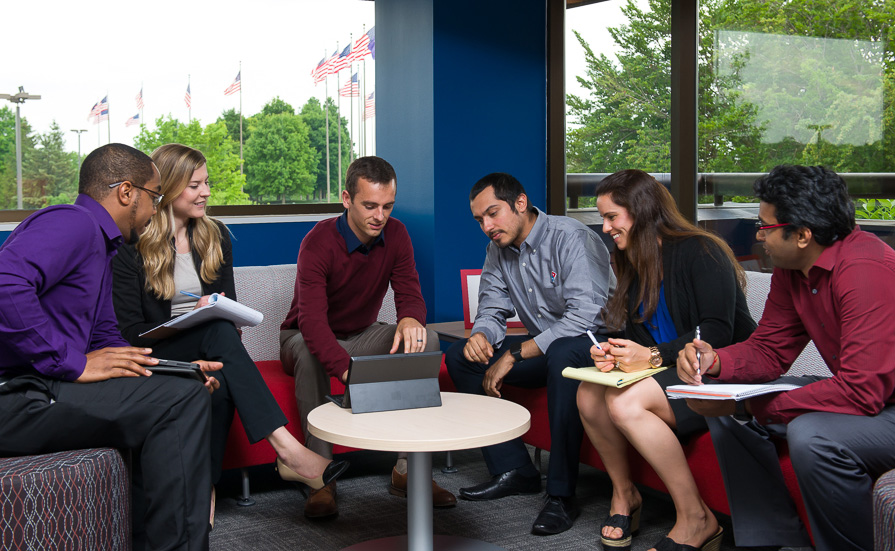 a group of people sitting around a table