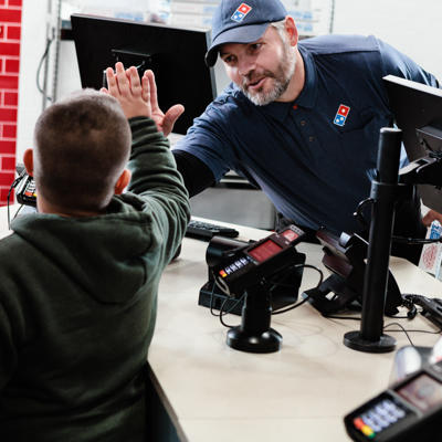 a man giving a high five to a boy