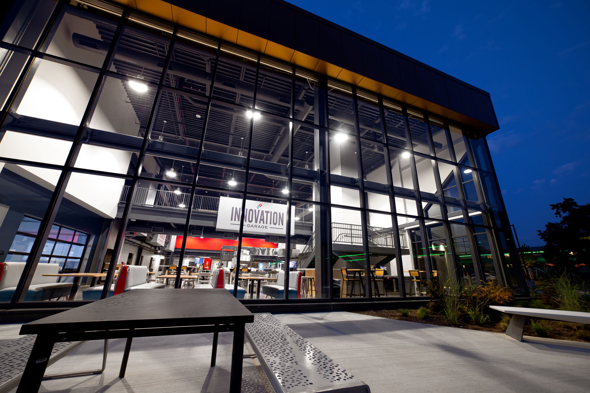 a building with glass walls and a sign