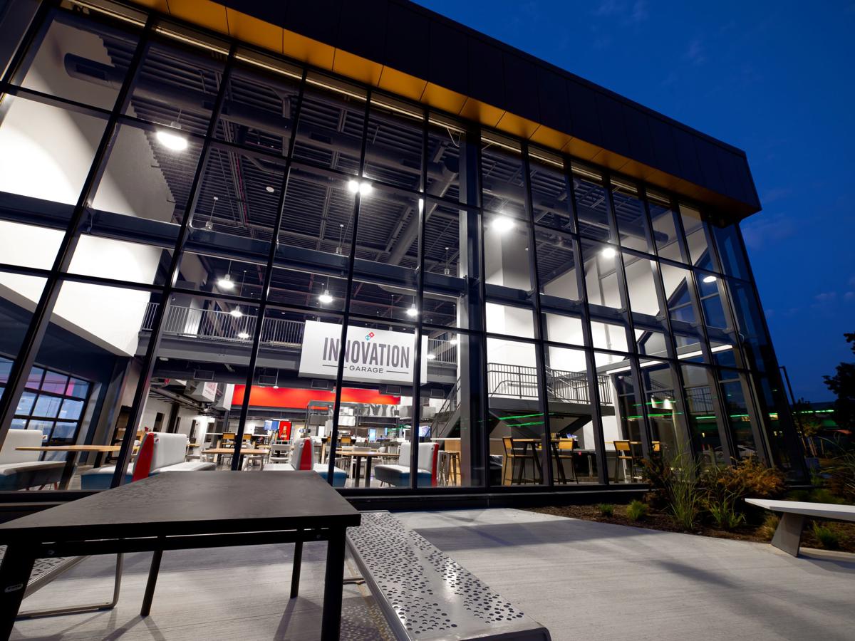 a building with glass walls and a sign